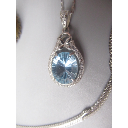 222 - Hallmarked Sterling silver necklace with oval cut light blue stone surrounded by clear stones, and a... 