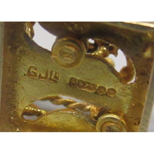 31 - 9ct yellow gold charm in the form of a boxing ring and boxers, 2.9g, and a yellow metal boxing glove... 