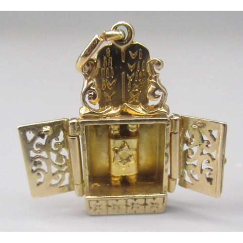 44 - 9ct yellow gold bible charm, stamped 375, and a yellow metal Torah ark charm (possible worn hallmark... 