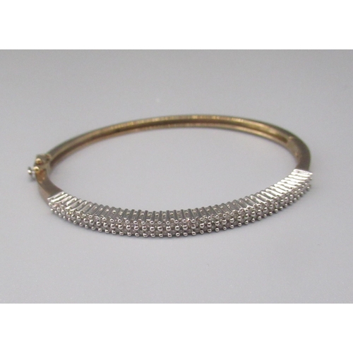 897 - 9ct gold bangle set with brilliant cut diamonds, with box clasp, stamped 375, 12.3g