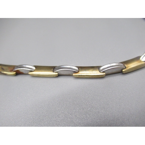 899 - 9ct yellow and white gold articulated necklace with box clasp closure, stamped 375, 18.9g