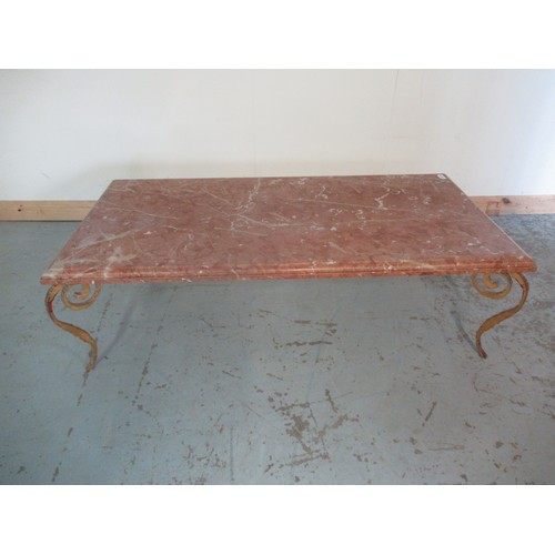 783 - Contemporary coffee table, moulded edge rouge marble top on wrought metal base with four S scroll le... 