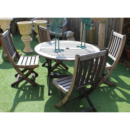 1161 - Teak circular garden table with four folding chairs, W109cm H69cm