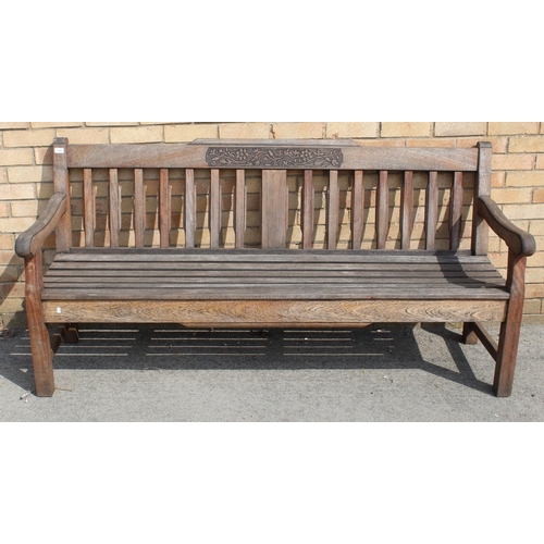 1162 - Bridgman teak garden bench with floral carved to back L181cm D51cm H89cm