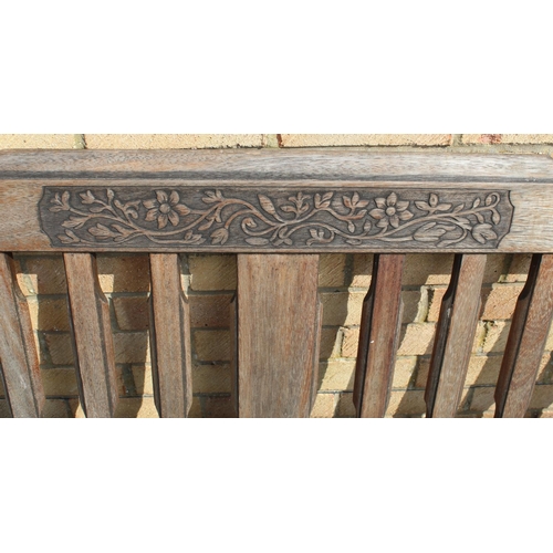 1162 - Bridgman teak garden bench with floral carved to back L181cm D51cm H89cm