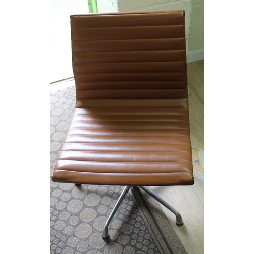 671 - ICF swivel chair Made according to the the Original Design of Charles Eames, brown upholstered on ch... 