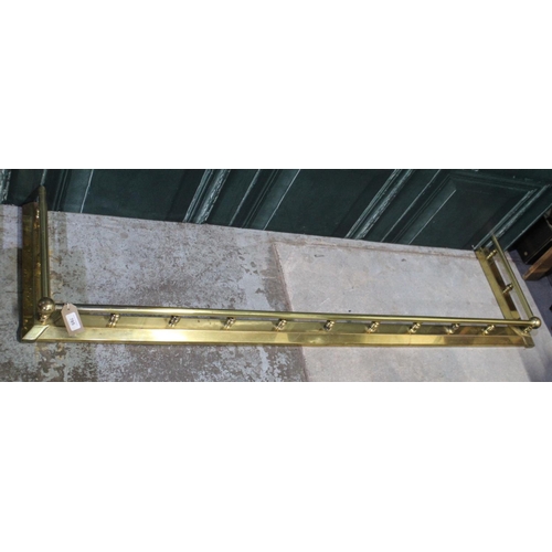 785 - Regency style brass fender, plain top rail on turned balusters, W160cm D40cm H12cm