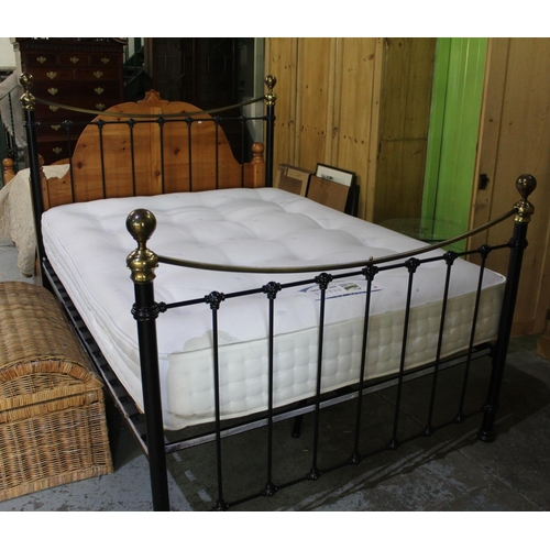 794 - Victorian style double bed, black metal head and footboards with dished brass top rails and finials,... 