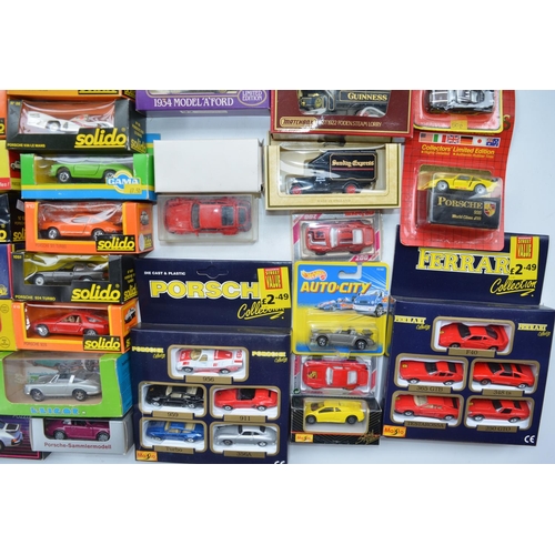 101 - Collection of boxed diecast model vehicles, various scales and manufacturers to include Solido, Cara... 