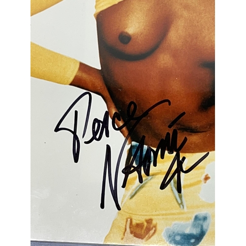 326 - Bare breast photo of Naomi Campbell, 20.5cm x 25.5cm, with signature, with Certificate of Authentici... 