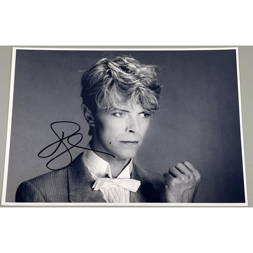 485 - David Bowie photo, with signature, 29.8cm x 21cm, with Certificate of Authenticity from Heroes & Leg... 