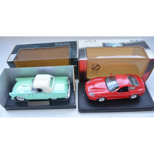 112 - Four boxed 1/18 diecast model cars to include Burago Jaguar SS100 (1937), James Bond Jaguar XKR Road... 