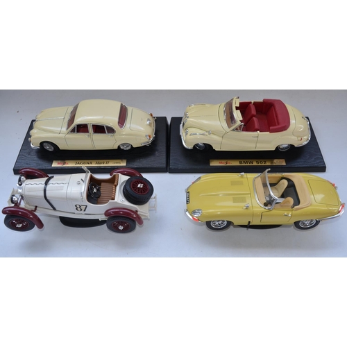 113 - Collection of 1/18 scale diecast model cars from Burago, Maisto, Ertl and Motor Max. Also included a... 