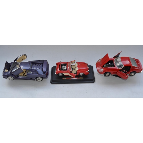 113 - Collection of 1/18 scale diecast model cars from Burago, Maisto, Ertl and Motor Max. Also included a... 