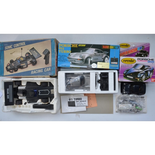 124 - Collection of radio controlled, battery operated and sonic control car models, mostly Porsche relate... 