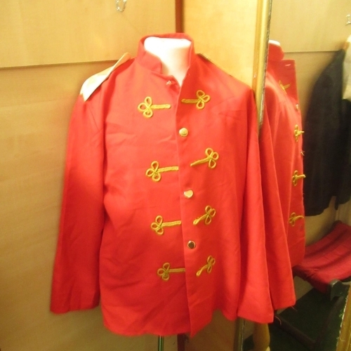 126 - Quantity of marching band uniforms inc. red jackets, white trousers, red and white marching band hat... 