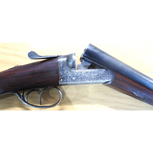 789 - AYA side by side shotgun, with double trigger action, ejector, floral and leaf engraving to lock wit... 