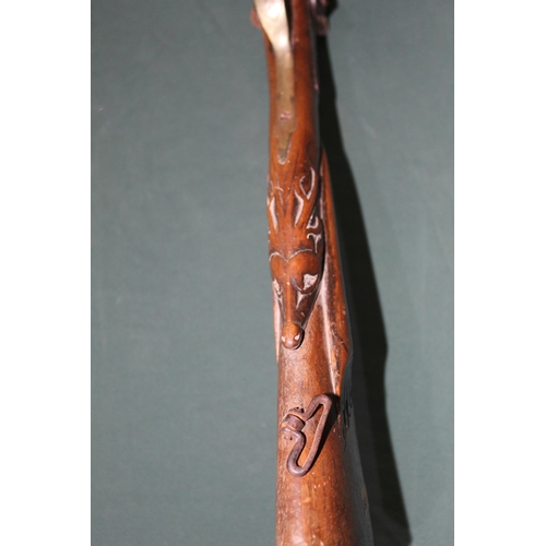 810 - Relic condition muzzle loading double barreled sporting shotgun with ornate carving to the stock dep... 