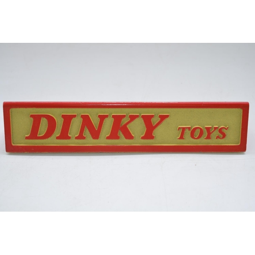 175 - Vintage Dinky Toys triangular cross-section shop counter display sign, L175xH32xW36mm, cast metal wi... 