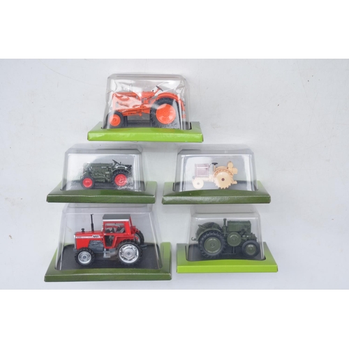 180 - Twenty diecast small scale model tractors/agricultural machinery by Hachette Partworks