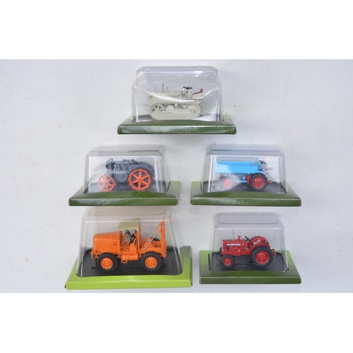 181 - Twenty diecast small scale model tractors/agricultural machinery by Hachette Partworks and 3x Atlas ... 