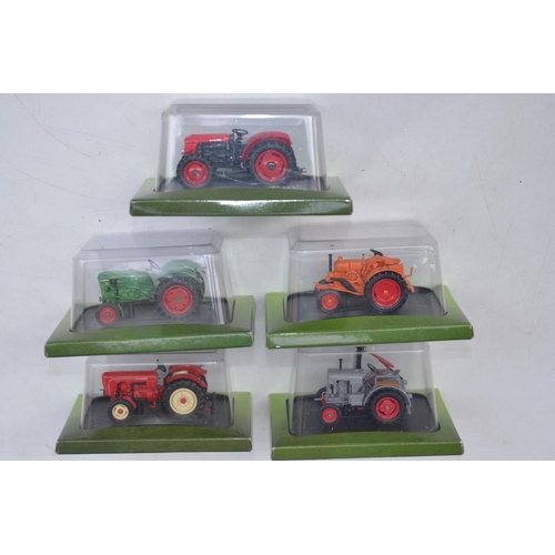 183 - Twenty Five diecast small scale model tractors/agricultural machinery by Hachette Partworks