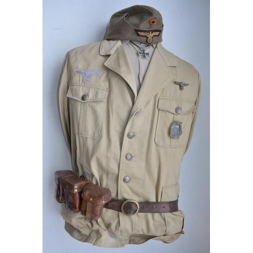 905 - German Afrika Korps jacket by Marquarot & Schulz, cap, leather belt and ammunition pouches. Complete... 