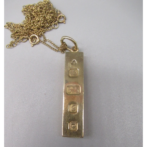 745 - 9ct yellow gold ingot pendant, by KMJ, London, 1977, on yellow metal chain, gross 37.7g