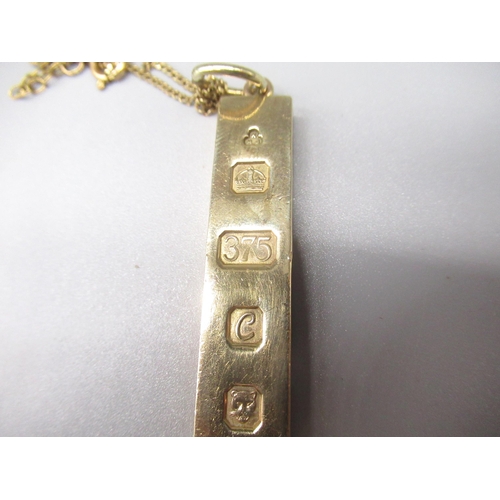 745 - 9ct yellow gold ingot pendant, by KMJ, London, 1977, on yellow metal chain, gross 37.7g