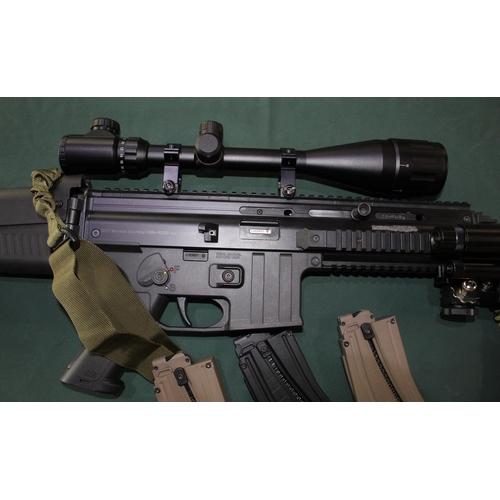 828 - .22RF ISSC self loading rifle with three magazines, detachable sound moderator, Vlife 6-24x50 scope,... 