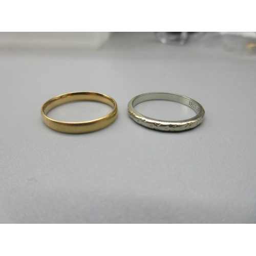 14 - 18ct yellow gold plain wedding band, size L1/2, and a 18ct white gold wedding band with etched desig... 