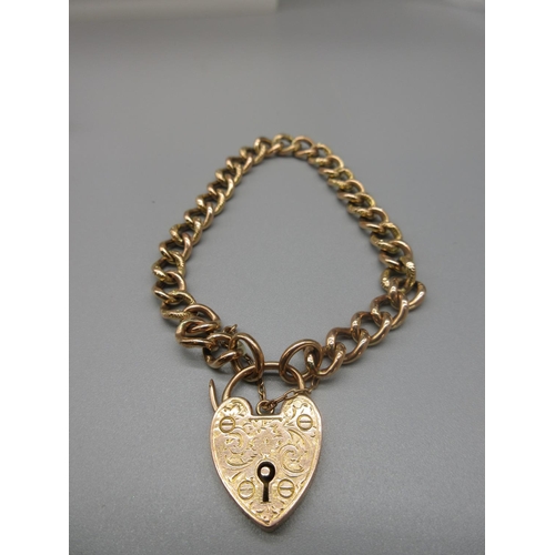 18 - 9ct yellow gold chain link bracelet with engraved heart padlock clasp and safety chain, stamped 9ct,... 