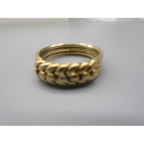 19 - 18ct yellow gold ring with braid detail, stamped 18, size Q, 7.1g