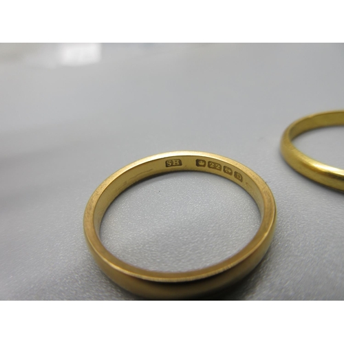 22 - two 22ct yellow gold wedding bands, sizes L1/2 and M, both stamped 22, 5.2g