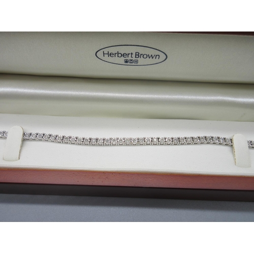 26 - 9ct white gold tennis bracelet set with diamonds in illusion settings, stamped 375, 19cm (including ... 