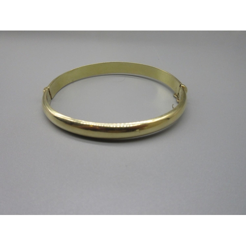 51 - 14ct yellow gold plain bangle, with box clasp, stamped 585, 12.0g
