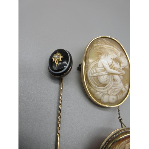 6 - Victorian yellow metal stick pin, the black cabochon banded agate set with brilliant cut diamond in ... 