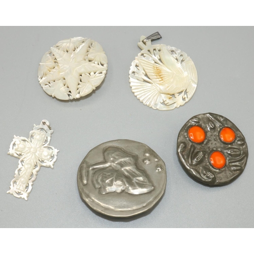 302 - Carved mother of pearl jewellery: crucifix and bird pendants, star brooch, D3.5cm; and two Arts & Cr... 