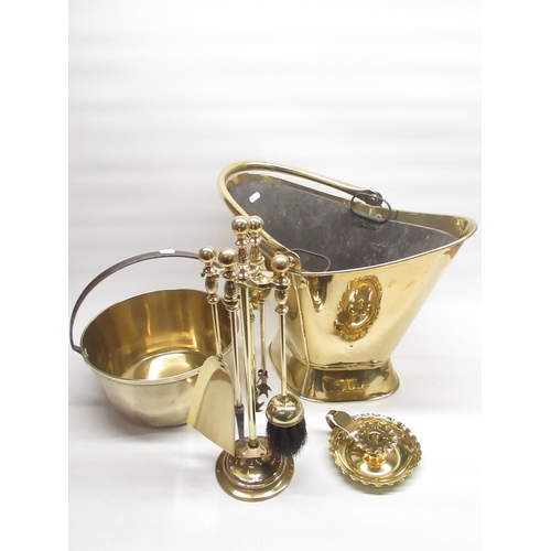 333 - Brass coal scuttle, brass jam pan, brass candle holder and a brass companion set (4)