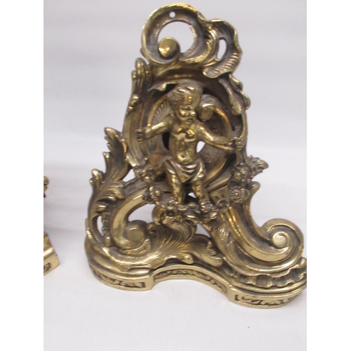 39 - Anthea Turner Collection - C20th brass rococo style 3 section fender, adorned with cherubs holding g... 