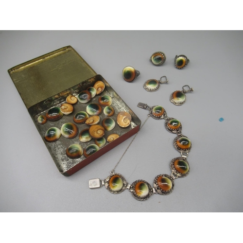 57 - Collection of white metal jewellery set with operculum shells, and a quantity of loose operculum she... 