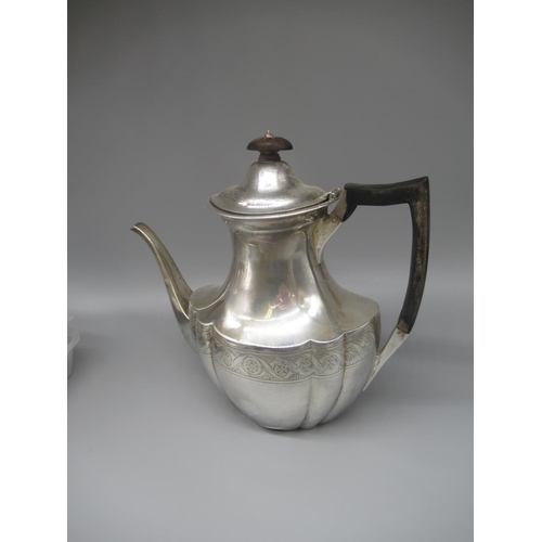 82 - Victorian hallmarked Sterling silver lobed coffee pot with engraved decoration, ebonised handle and ... 