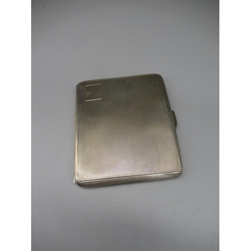 83 - ER.II hallmarked Sterling silver cigarette case with engine turned detail and gilded interior, by Fr... 