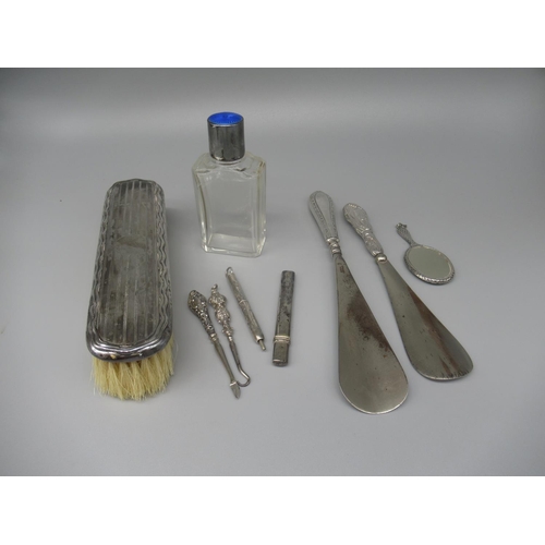 86 - Glass dressing table bottle with hallmarked silver and blue enamel lid, a dressing table brush with ... 