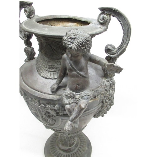 200 - Jenny Powell Collection - Large cast metal urn shaped two handled vase, decorated with a cherub, on ... 