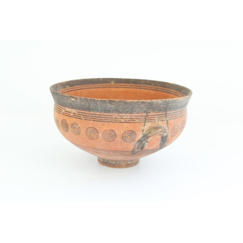 769 - Cypriot Cypro-Archaic period terracotta skyphos, black border with concentric circle decoration, H9.... 