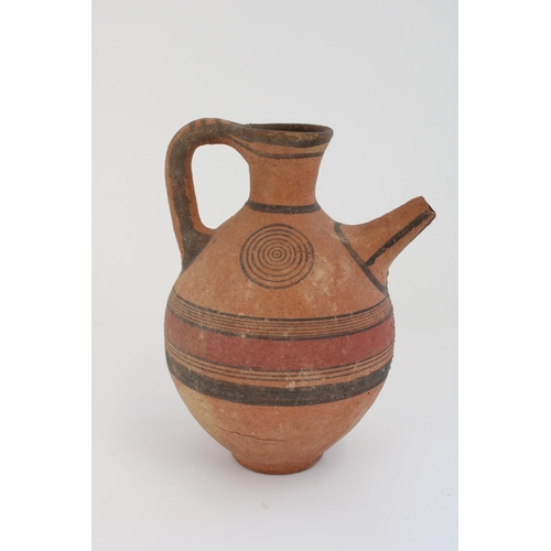 772 - Cypriot Cypro-Archaic period terracotta spouted jug, black border with red central band and concentr... 