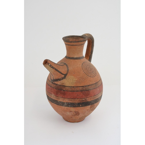 772 - Cypriot Cypro-Archaic period terracotta spouted jug, black border with red central band and concentr... 