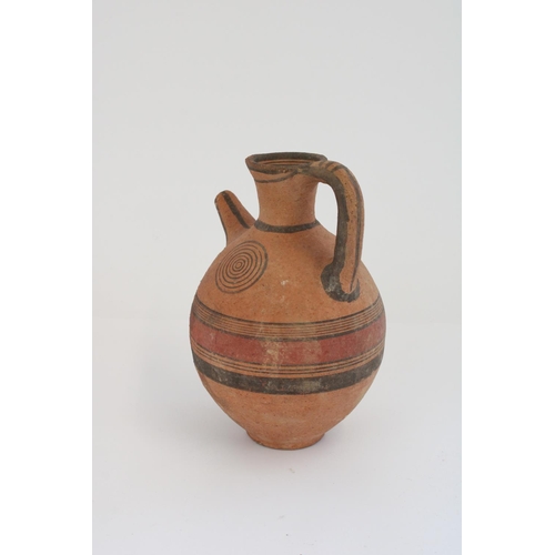 772 - Cypriot Cypro-Archaic period terracotta spouted jug, black border with red central band and concentr... 