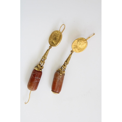 779 - Pair of ancient Cypriot gold drop earrings, the Carnelian bead drops finely etched with standing fem... 